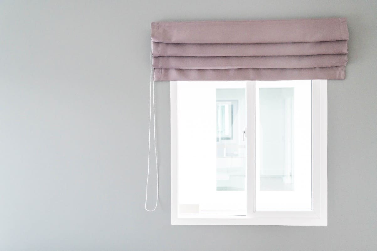 What should I consider when choosing roller blinds for my windows?